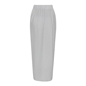Detailed macro view of silver metallic long skirt with elastic waist and glitter texture