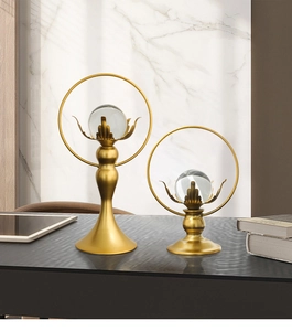 Close-up of luxury gold lotus crystal ball ornaments with brushed metal finish