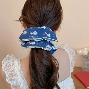 Navy floral scrunchie with white rabbit print and lace trim on a high ponytail