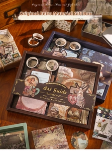 Detailed macro view of vintage Art Guide scrapbooking gift set with stickers and tapes