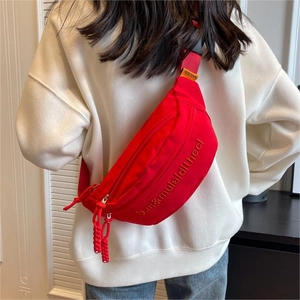 Red canvas crossbody chest bag for women featuring adjustable strap and embroidery