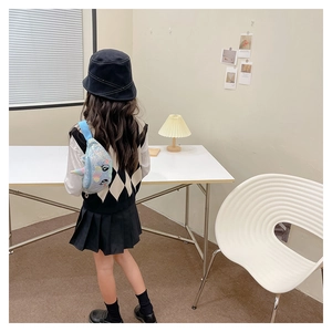 Rear view of a girl wearing a shiny sequin unicorn waist bag with cute 3D horn and ears