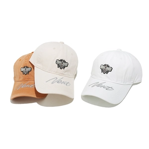 Baseball caps with bee embroidery and Vent lettering in orange, cream, and white