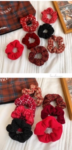 Detail of red and black knit velvet scrunchies set with various autumn textures