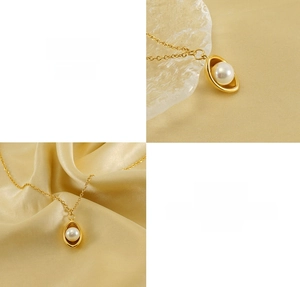 Detail showing 18k gold plated titanium steel necklace with a single white pearl pendant