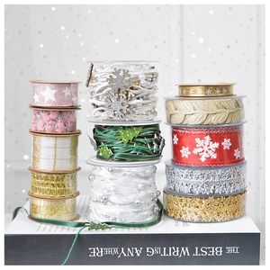Close-up of assorted festive Christmas ribbons with snowflake patterns and pearl beads