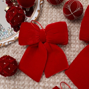 Elegant red velvet Christmas bow ornament for tree decoration with hanging string