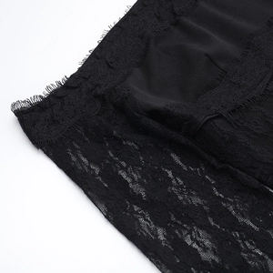 Gros plan sur un tissu de dentelle noire élégant avec motifs floraux et bords en dentelle