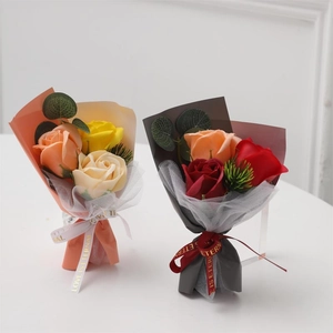Soap flower mini rose bouquets in orange and yellow with elegant mesh gift wrapping
