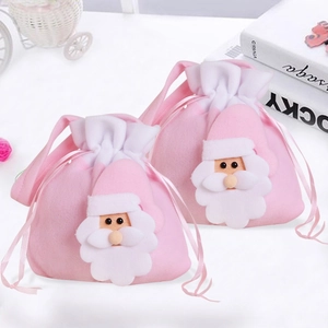 Pink drawstring Christmas gift bag featuring a 3D Santa Claus applique in soft velvet