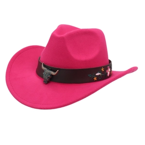 Close-up of pink cowboy hat featuring bronze bull head buckle and floral embroidery details