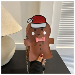 Detail of gingerbread man crossbody bag with gold chain strap and festive decorations