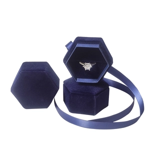 Blue hexagonal velvet ring box with satin ribbon for jewelry packaging and storage