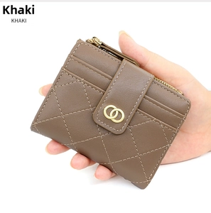 Detail of khaki quilted leather wallet with gold double-ring buckle and zipper closure