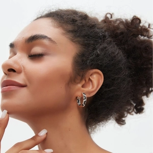 Fashionable gold-plated leopard print hoop earrings with micro-pave cubic zirconia crystals