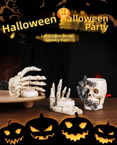 Detailed resin skull and skeleton hand candle holder set for Halloween home decor