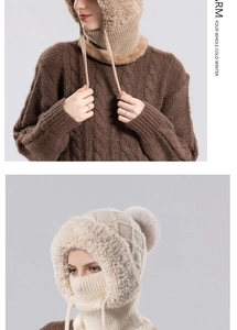 Detail of winter knitted hood with fleece lining and faux fur trim in coffee and beige