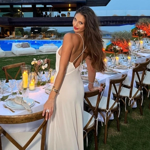 Elegant white satin maxi dress with V-neckline and open back design for evening parties