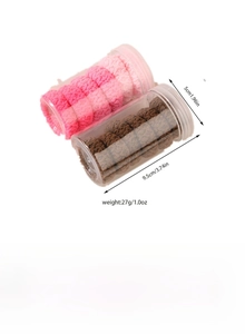 Macro shot showing size specifications of jacquard elastic hair ties in a clear container