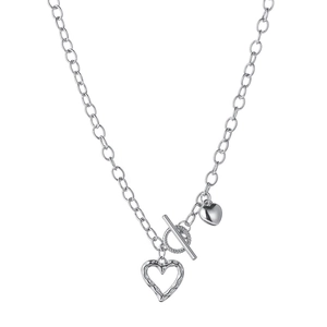 Detail of silver heart pendant necklace featuring heavy link chain and toggle clasp