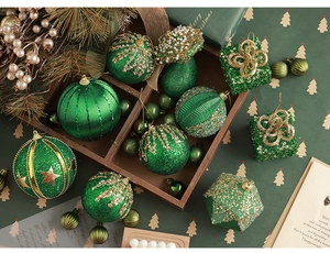 Assorted dark green and gold flocked Christmas ornaments including pinecones and gift boxes