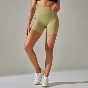 Close-up of high-waisted olive green yoga shorts with elastic seamless waistband