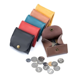 Minimalist leather coin purses in multiple colors with snap closure for earphone storage