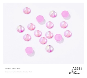 Detail of 11mm pink aurora round flatback nail art gems with pearlescent magic finish