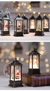 Close-up of vintage bronze Christmas lanterns with warm lights and snow globe effects