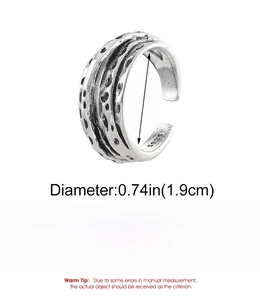 Macro detail of retro textured alloy ring showing hammered finish and size specifications