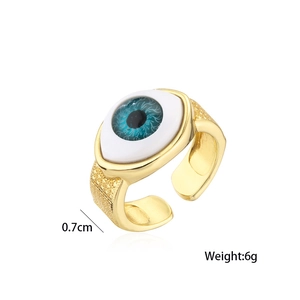Detailed close-up of adjustable 18K gold plated evil eye ring with blue enamel iris