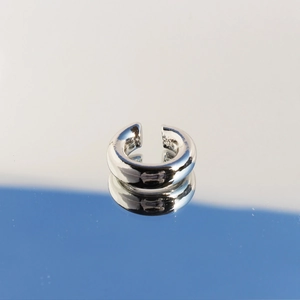 Polished silver C-shaped hollow ear cuff in minimalist high-gloss finish for non-pierced ears