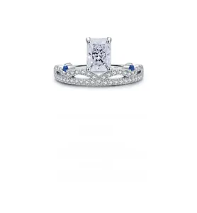 Close-up of S925 sterling silver crown ring with rectangular diamond and blue accents
