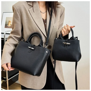 Size comparison of black lychee leather bucket bags featuring iconic bamboo buckle closures