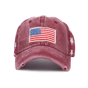 Detail of vintage washed baseball cap featuring USA flag embroidery and star mesh pattern