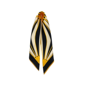 Detailed view of striped silk scarf with ginger yellow, black and beige geometric pattern