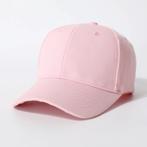 Detail view of pink cotton twill baseball cap showing six-panel stitching and curved brim