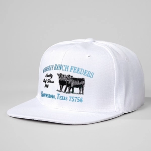 Close-up of vintage Whiskey Ranch Feeders beef theme embroidery on a white flat brim hat