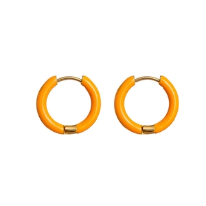 Detail of round orange enamel earrings with 18K vacuum plated stainless steel hoops