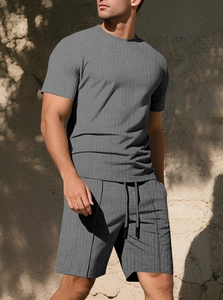 Close-up of men's grey summer set with distinct waffle texture fabric on the shorts and shirt