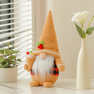 Christmas plush gnome in pointed brown hat with holly leaf and red plaid outfit