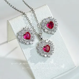 Elegant heart-shaped ruby-red jewelry set with sparkling pavé cubic zirconia