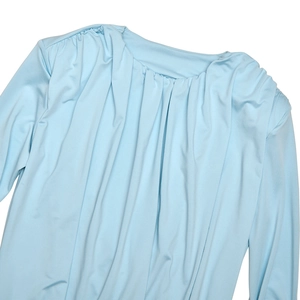 Detailed close-up of light blue ruched fabric texture on a long sleeve bodysuit
