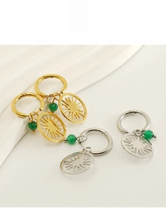 Detail of 18K gold-plated sun earrings with green beads and skin-friendly lead-free material