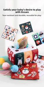 Detail of Montessori tissue box toy with festive Christmas patterns and colorful soft fabric