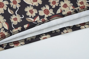 Detailed close-up of high-quality floral fabric and precision double-stitched hem finish