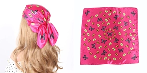 Pink silk scarf with butterfly print shown on a model and as a full flat lay display