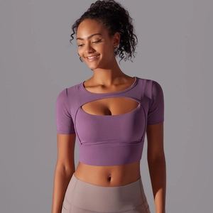 Detail of purple short sleeve yoga top with hollow layered design and high stretch fabric