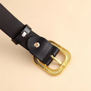 Genuine black leather belt for women featuring a gold rectangular buckle with grid texture