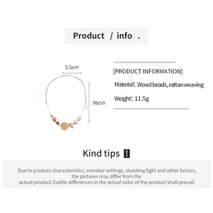 Detail view of bohemian wood bead and rattan necklace with dimensions and weight info